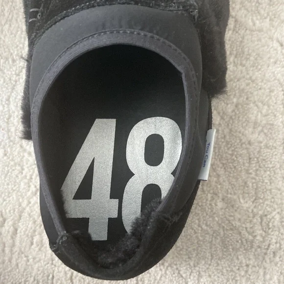 P448 bubble Genuine shearling slip on sneakerin black